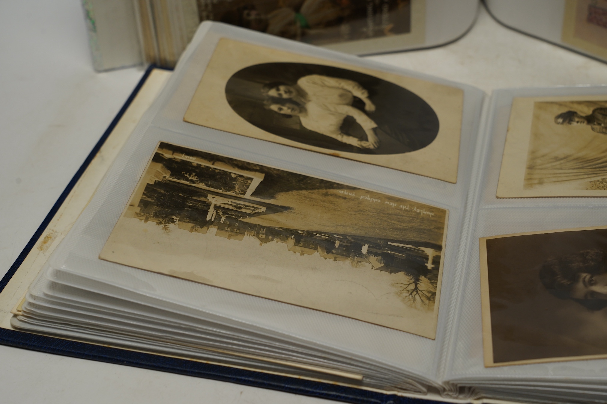 Two albums of Edwardian and later topographical and humorous postcards. Condition - good